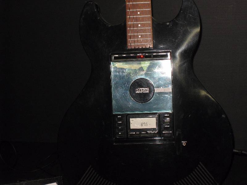 Guitar shaped CD player / radio with stand, looks like authentic guitar
