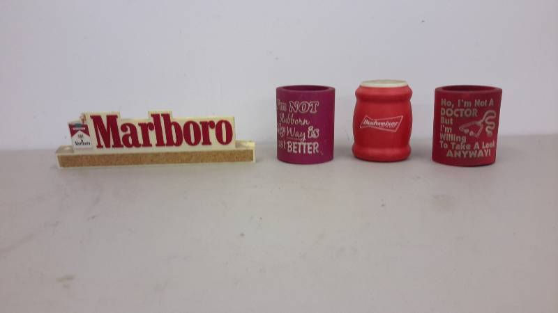 lot 88 image: Can coozie and marlboro sign