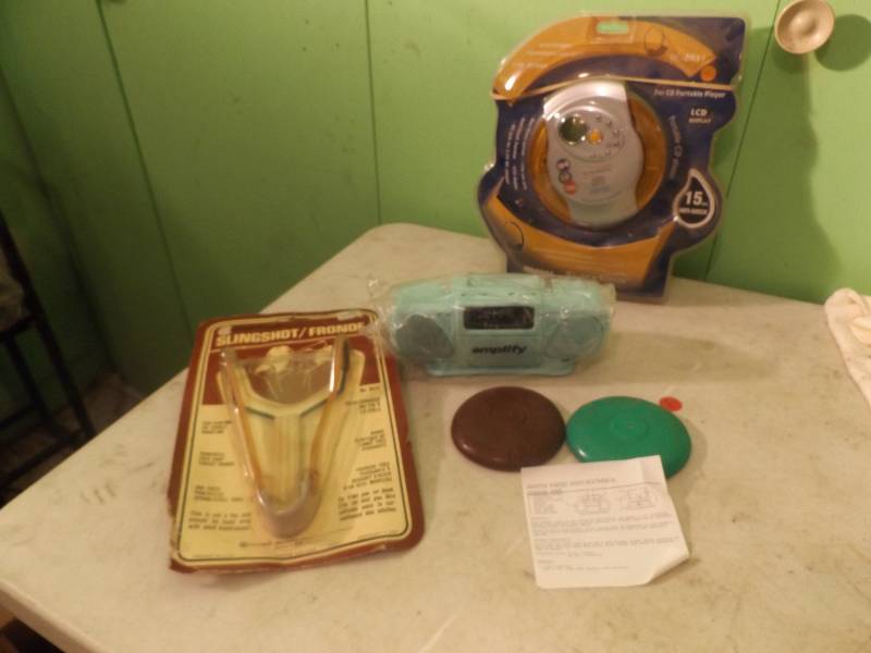 lot 122 image: Portable CD Player, Radio, Sling Shot, Mini Frisbees