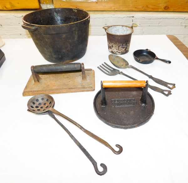 several vintage cast iron items pot ashtray and utensils