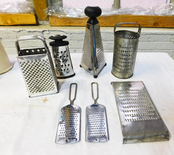 collection of vintage and modern kitchen shredders