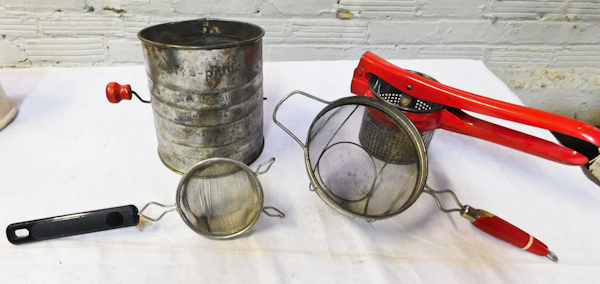 vintage kitchen items sifters and potato press