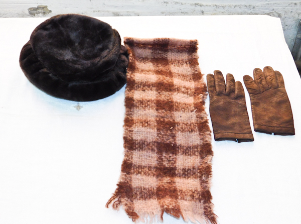 light brown plaid scarf gloves and a hat