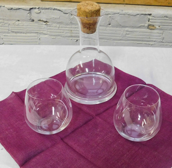 Decanter with two highball glasses with table linen