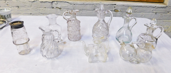 glass cruets several shapes and sizes some with stoppers