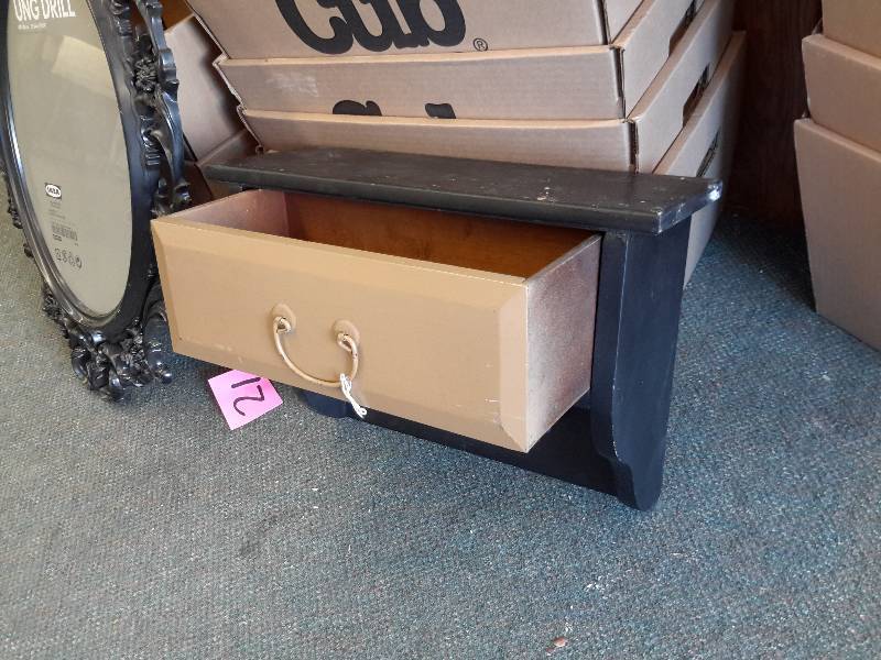 lot 21 image: Wood drawer unit with shelf.  16in w x 7 in d x 14in h. IKEA  mirror with scrolled frame.  Overall dim  34in h x 23in w  Frame made of plastic