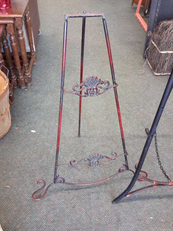 lot 23 image: 2 Metal folding Easels..  One with 2 shelves, 31in h 1 with no shelves, 53 in h