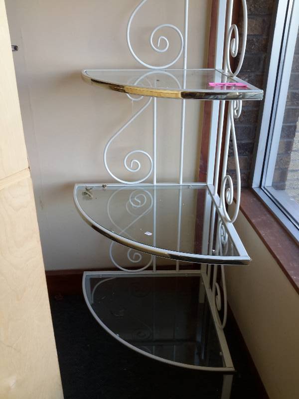 lot 37 image: Corner Bakers Shelf.  4 Shelf.. Bottom two shelves 24 in.. 6 ft. tall.  Metal and Glass