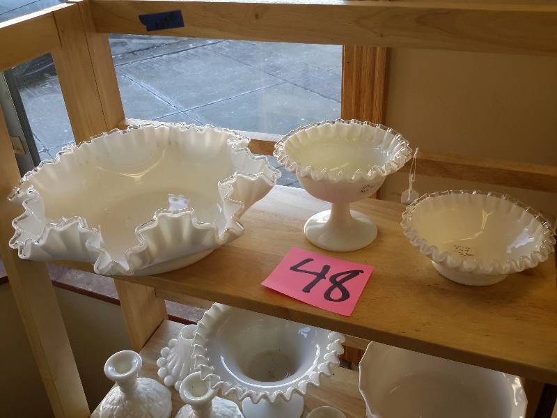 lot 48 image: 3 Fenton Bowls with tufted brims (top shelf).  Other white glass glassware as shown.. Not sure if it is Milk Glass or not