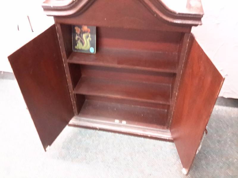 lot 77 image: Nice Walnut Wall cabinet with Floral designplanters paintings.  22in w x 7 in d x 31in h.. Has hangers on back.