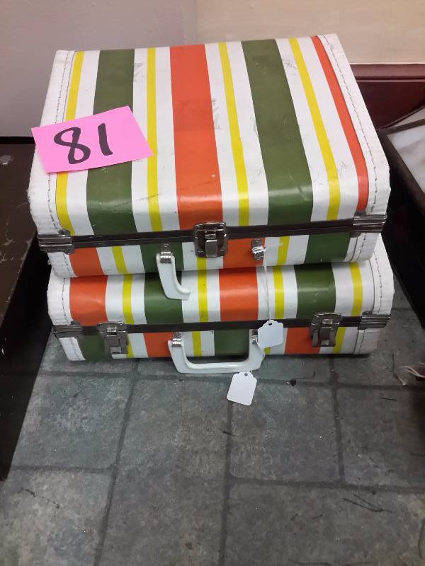 lot 81 image: 2 Drawer Metal card file cabinet  2, multi colored small suit cases.