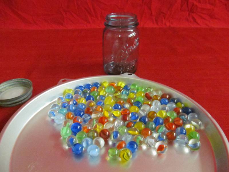 lot 29 image: vintage jar and marbles