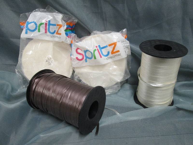 lot 67 image: Large rolls curling ribbon in white...