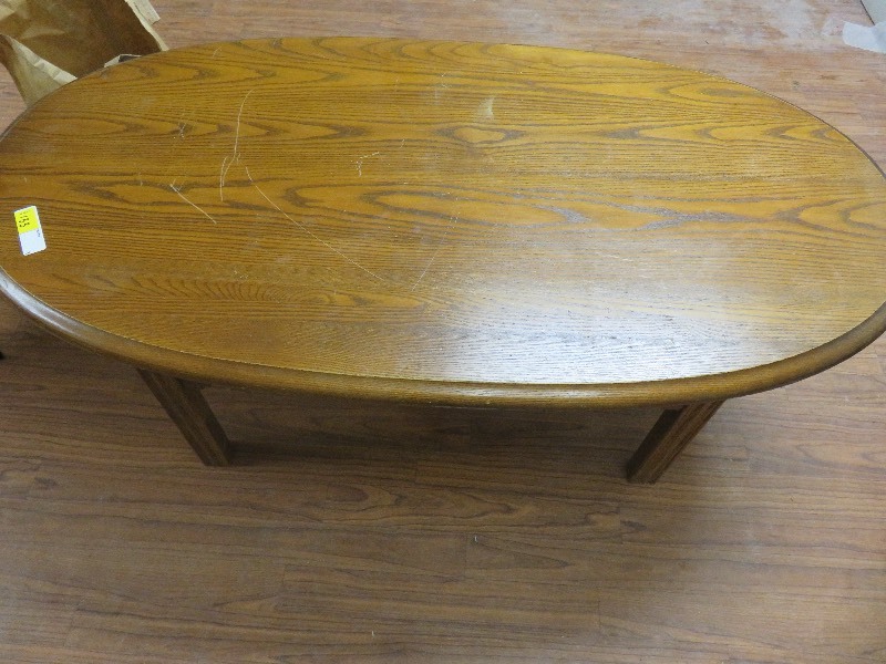 lot 133 image: Wood Oval Coffee Table