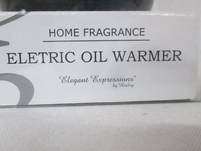 lot 26 image: Electric Oil Warmer