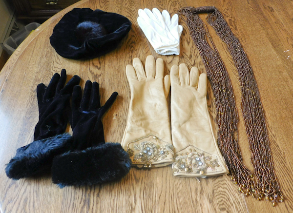 three pair of vintage gloves and a vintage hat