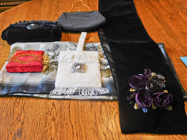 4 small handbags and two scarves