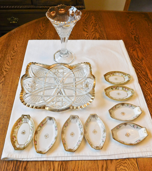 clear and amber plate and compote plus white and gold salt cellars