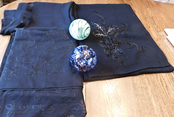 scarf a throw and two glass balls