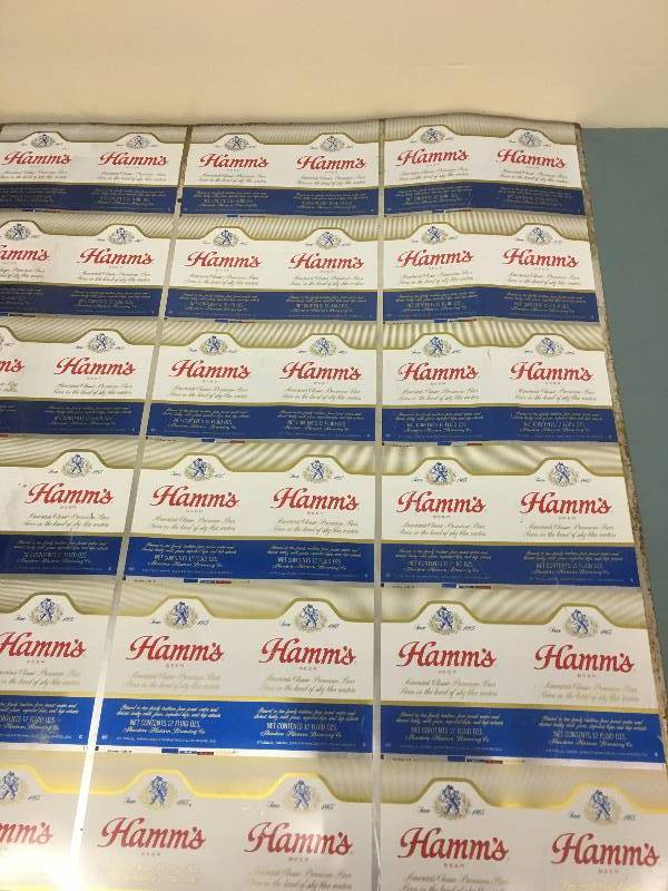 lot 22 image: hamms beer uncut sheet of beer cans