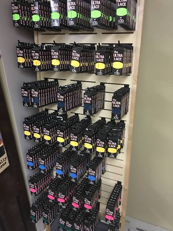 lot 41 image: slatewall hook shelving full of new shoe laces assortment of colors and sizes