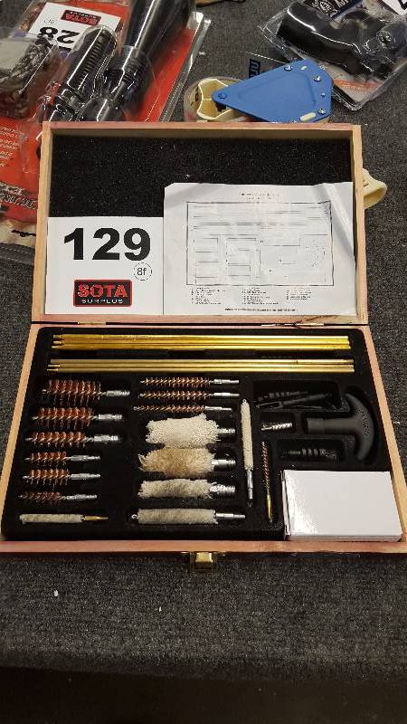 lot 129 image: UNIVERSAL GUN CLEANING KIT   RETURNED  (SEE PIC)