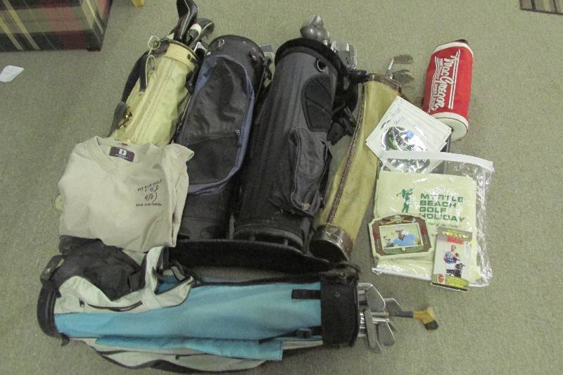 Large lot of golf clubs and bags wi...