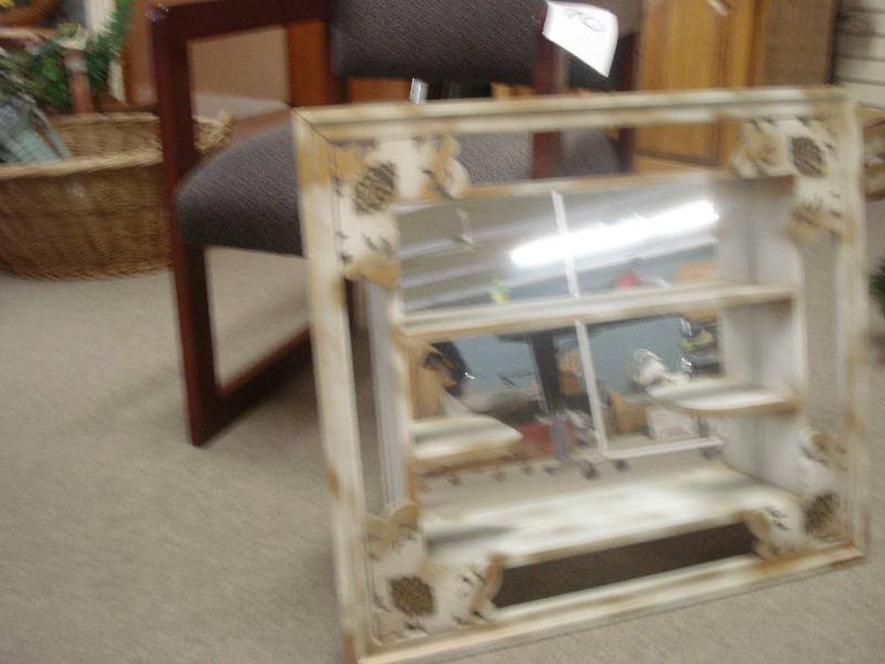 Waiting room chair and mirrored dis...