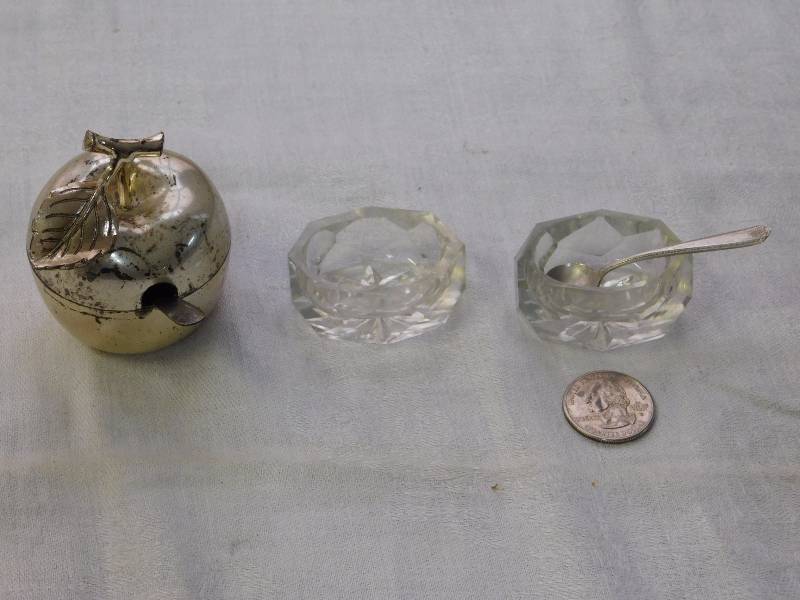 pair of cut glass salt cellars with one spoon and silver plate apple with sterling spoon
