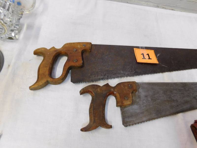 Very old gentlemans saw and carpenter saw and leather Field and Stream pouch