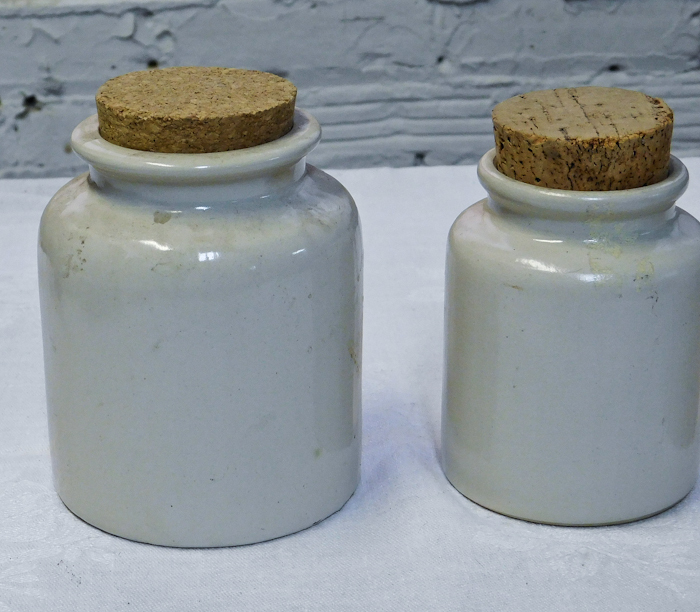 three French mustard crocks with cork stoppers