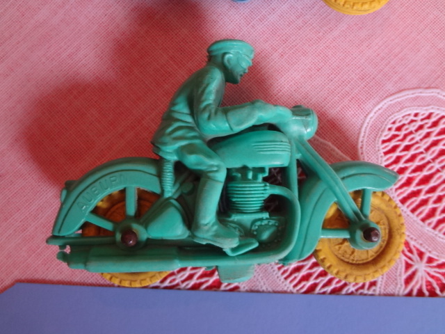 lot 15 image: Pair of Auburn Motorcycle riders, near perfect