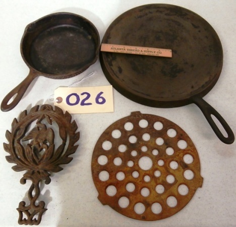 lot 26 image: Four Pieces of Vintage Cast Iron Kitchenware