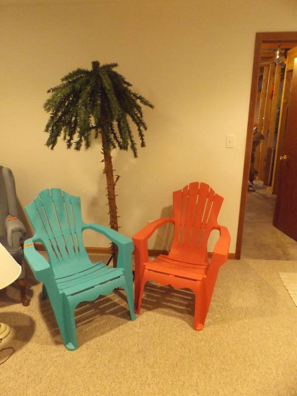 Plastic chairs and lighted palm  tree