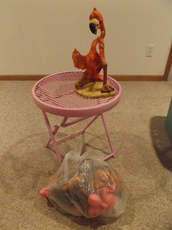 Pink folding table and flamingo wine bottle holder