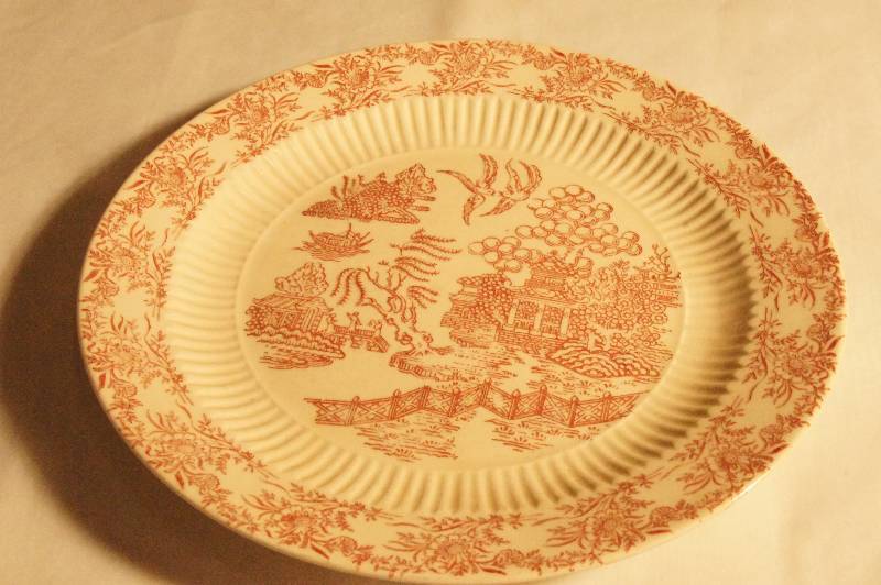 lot 407 image: Red Willow Plate  Approx. 9 12 W.  Hamilton Ross Ming Red Dinnerware.
