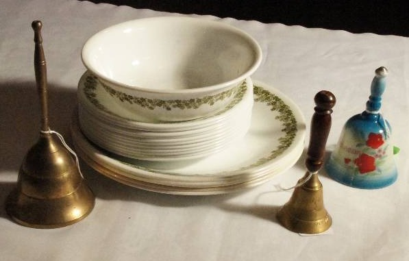 lot 414 image: Corelle Dishes- 1 Bowl Approx. 6 14 W. 11 Plates Approx. 6 14 W. 5 plates 8 34 W. 2 brass bells, and 1 ceramic bell Bahamas