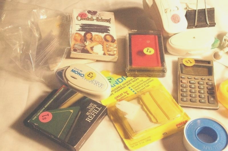 lot 416 image: Plastic folder flaps, paper clip, plastic letter opener, 2 notepads, tape rollers, labels, etc