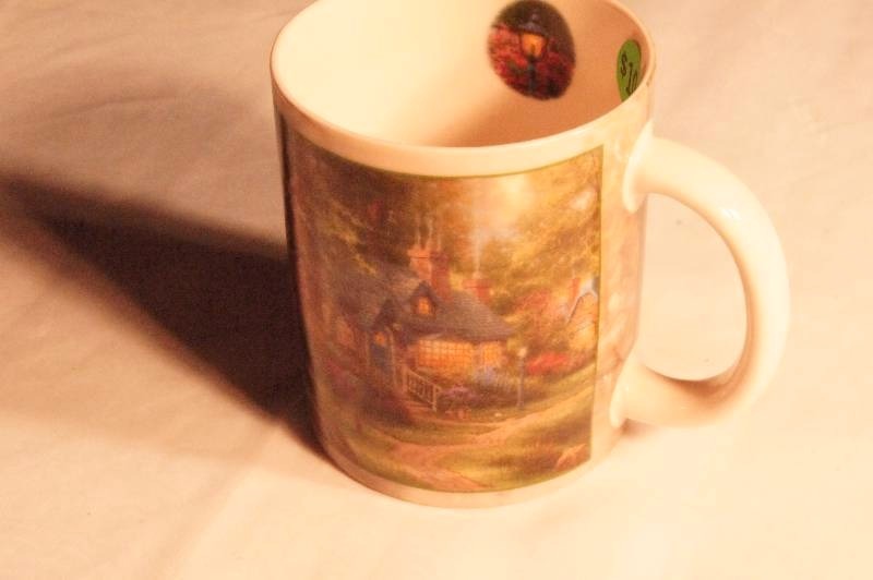 lot 444 image: Collectible Thomas Kinkade mug.