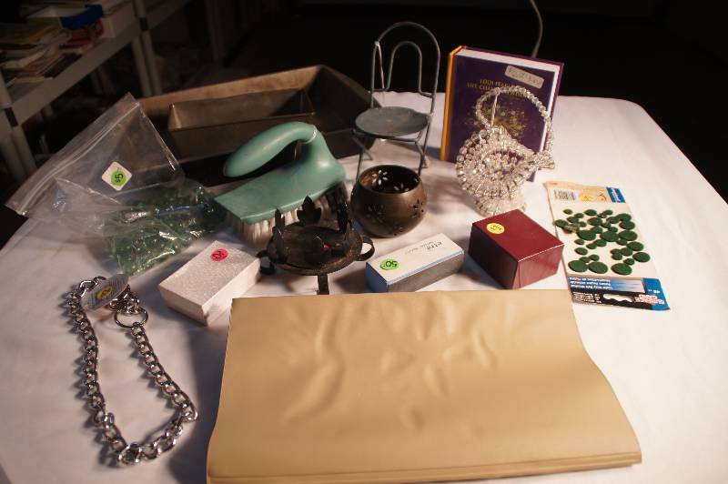 lot 533 image: Lot - Tin Pans, Scrub Brush, Dog Chain, Candleholders, Safety Pin Hand Made Basket, bag of Marbles, Book, ETC