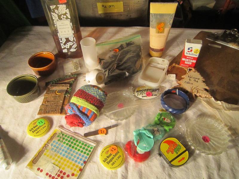 lot 580 image: LOT - Clipboards, Body Wash, Body Cream, 2 Custard Dishes, Bracelets, Pins, Candleholders, Outhouse Plaque, Stickers, Party ToysMISC
