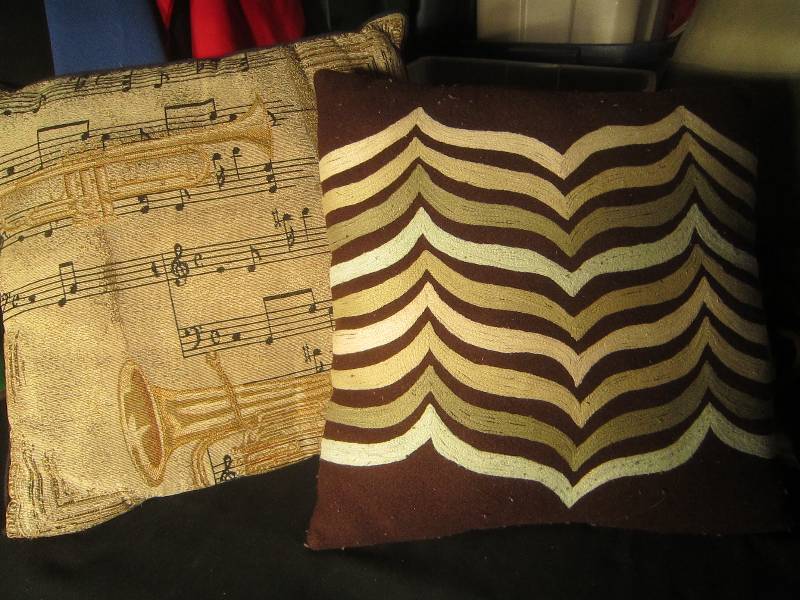lot 638 image: 2 Pillows, One with Trumpet