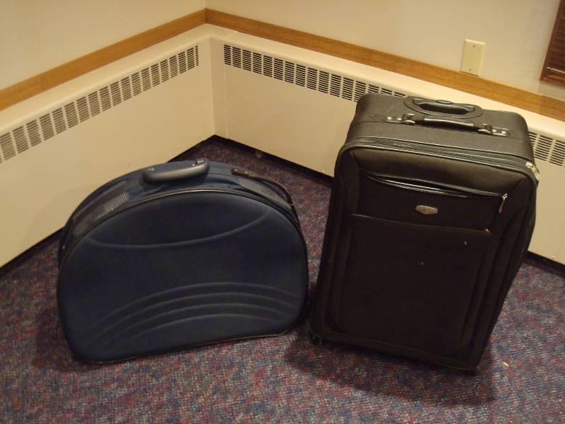Two Suit Cases With Wheels And Handles...