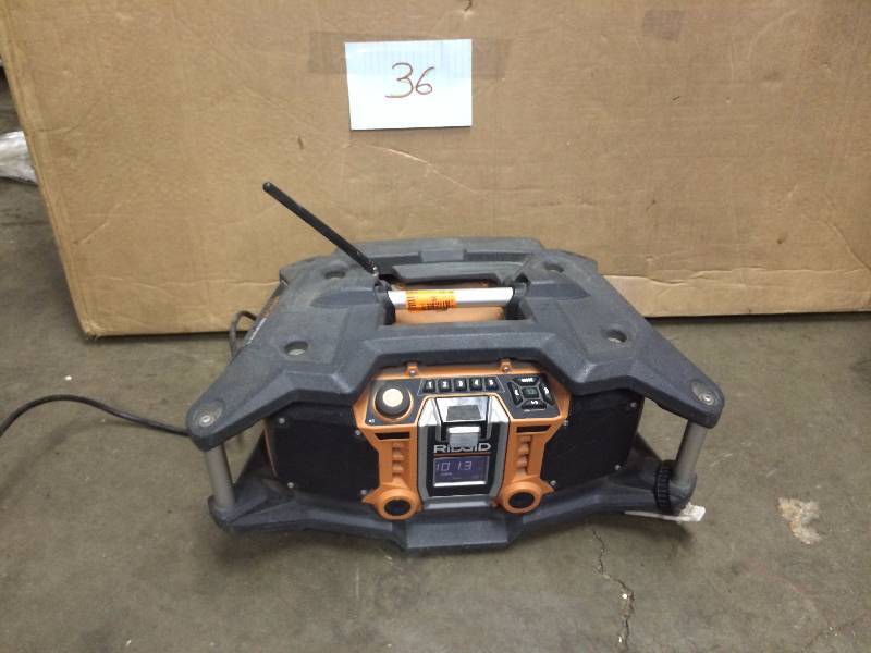 lot 36 image: Ridgid X4 18-Volt Cordless Jobsite Radio with ShockMount Technology used tested works
