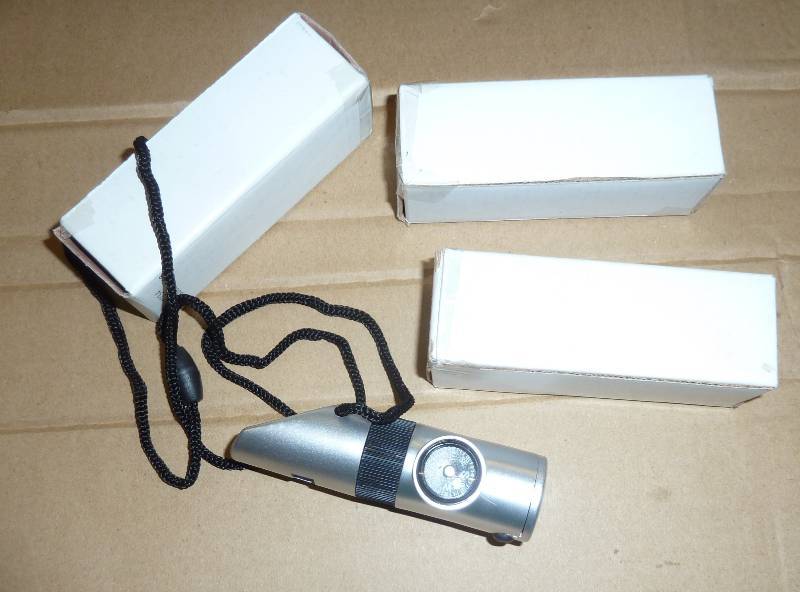 FOUR survival whistle, compass, lig...