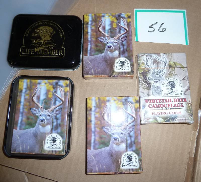 4 decks of playing cards, one with ...