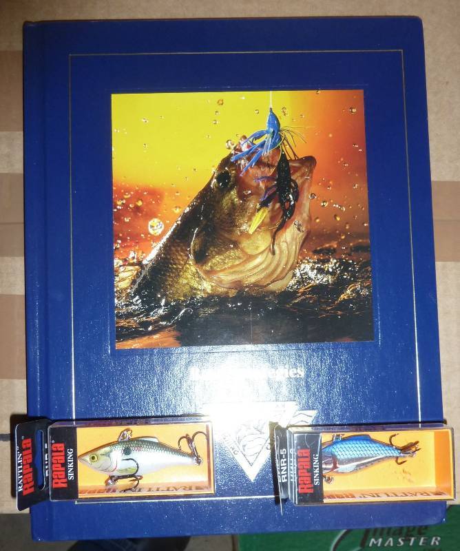 Bass fishing book and 2 rapala lure...