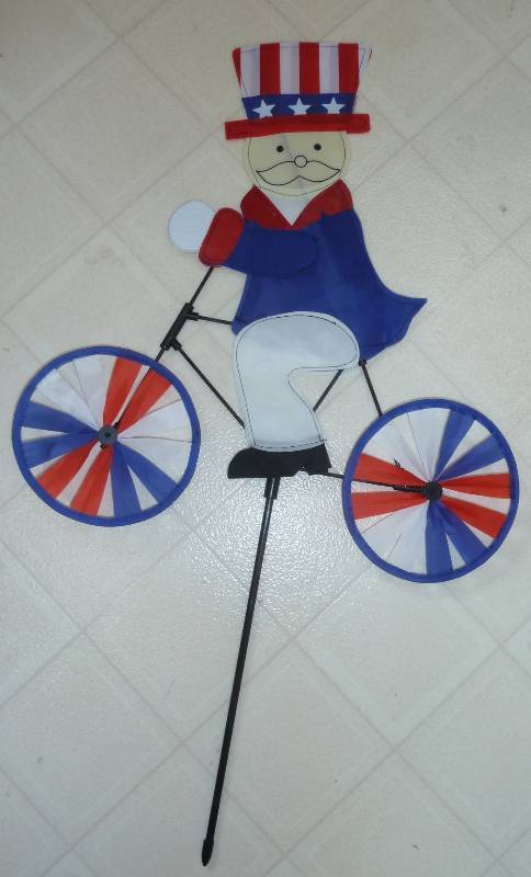 New Uncle Sam on a bicycle yard whi...