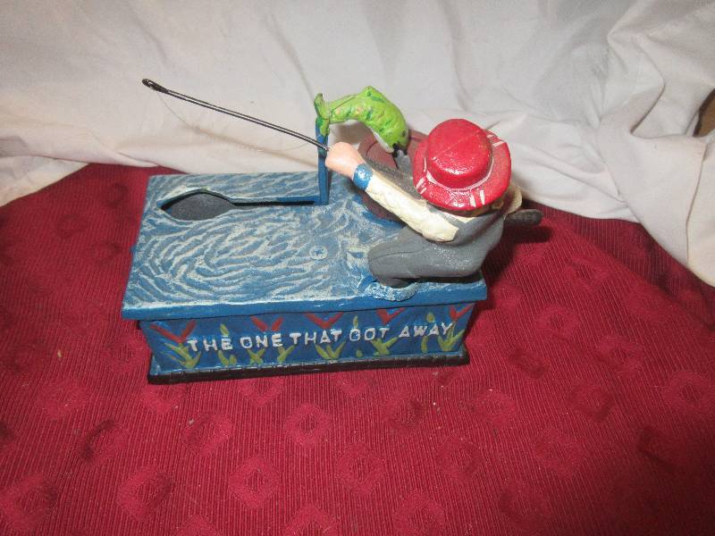 VINTAGE THE ONE THAT GOT AWAY CAST IRON COIN BANK