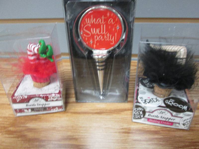 3 assorted bottle stoppers...